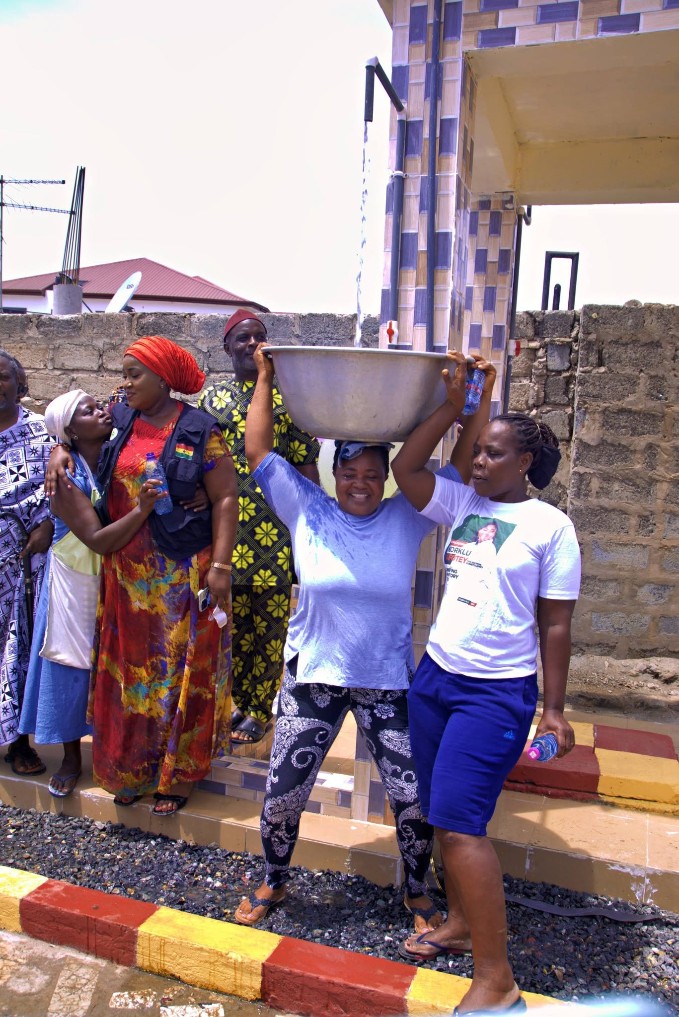 A resident collects water at the Odikoman community borehole
